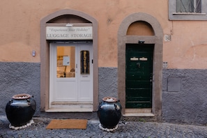 Experience your holiday at this charming entrance, featuring a convenient luggage storage and elegant stone arches.