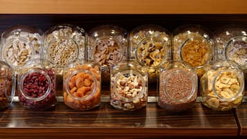 A display of various food items in glass jars.