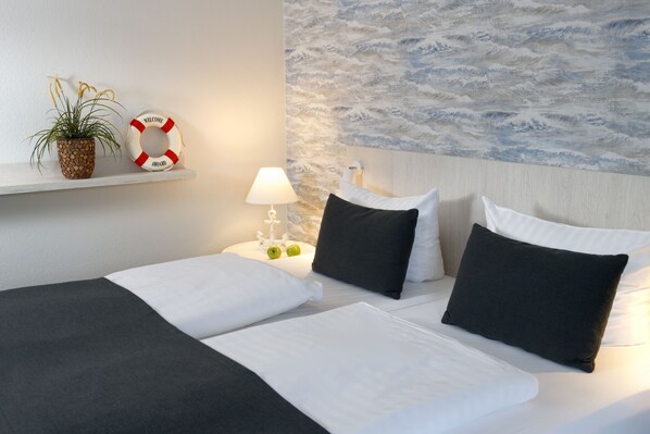 Habitación doble Premium | Escritorio, cortinas blackout, wifi gratis y ropa de cama 