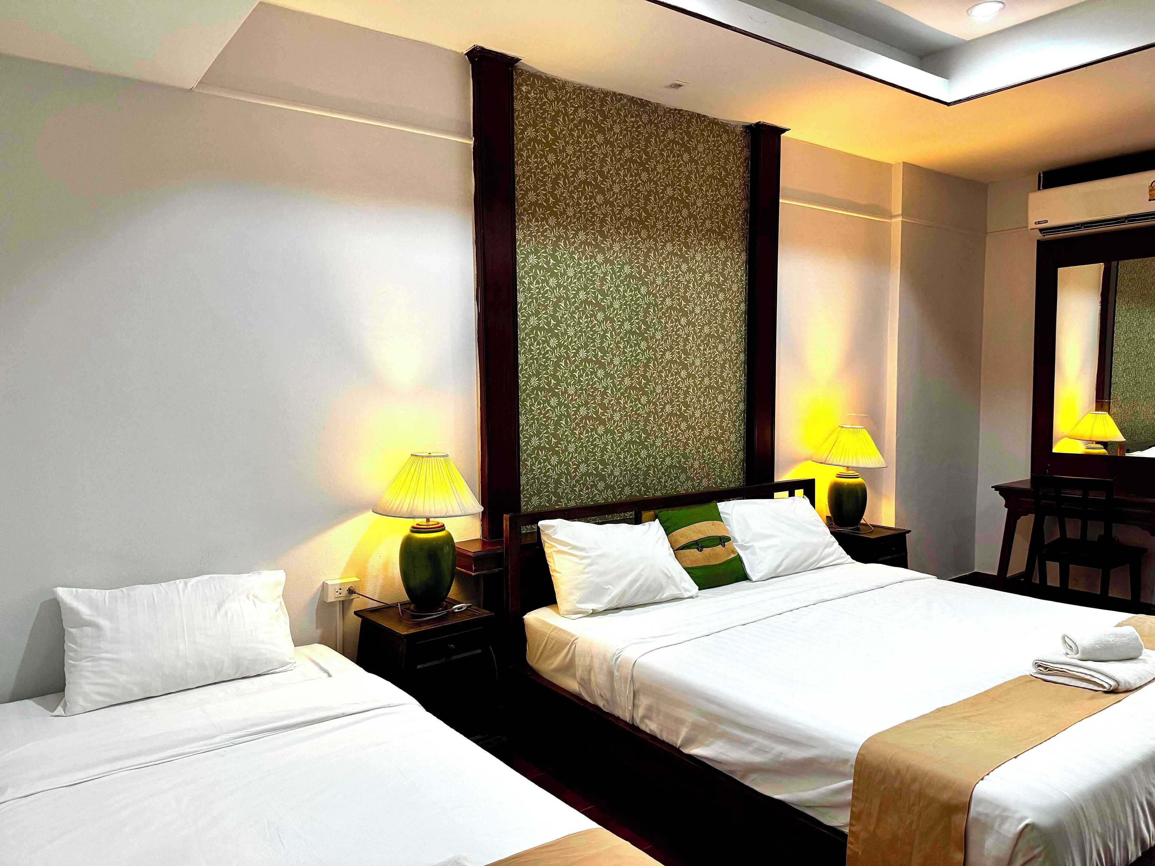 Deluxe Triple Room | 1 bedroom, minibar, in-room safe, individually decorated
