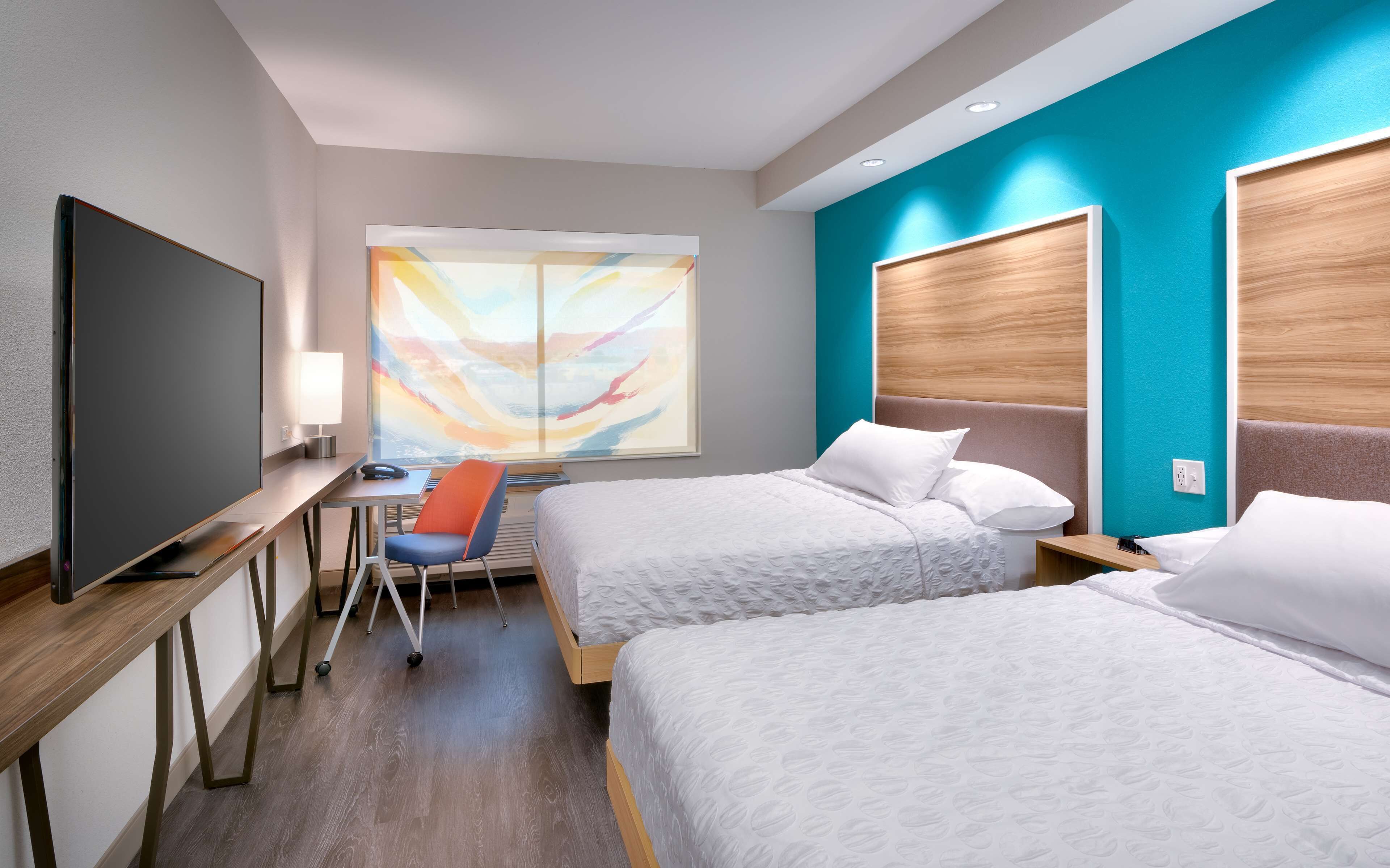 room, 2 queen beds | in-room safe, blackout curtains, iron/ironing board, cots/infant beds