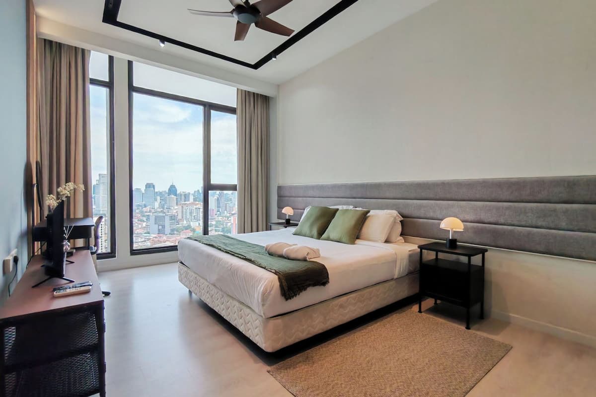 Deluxe Room (Modern Skyline Sanctuary) | Desk, laptop workspace, blackout drapes, iron/ironing board