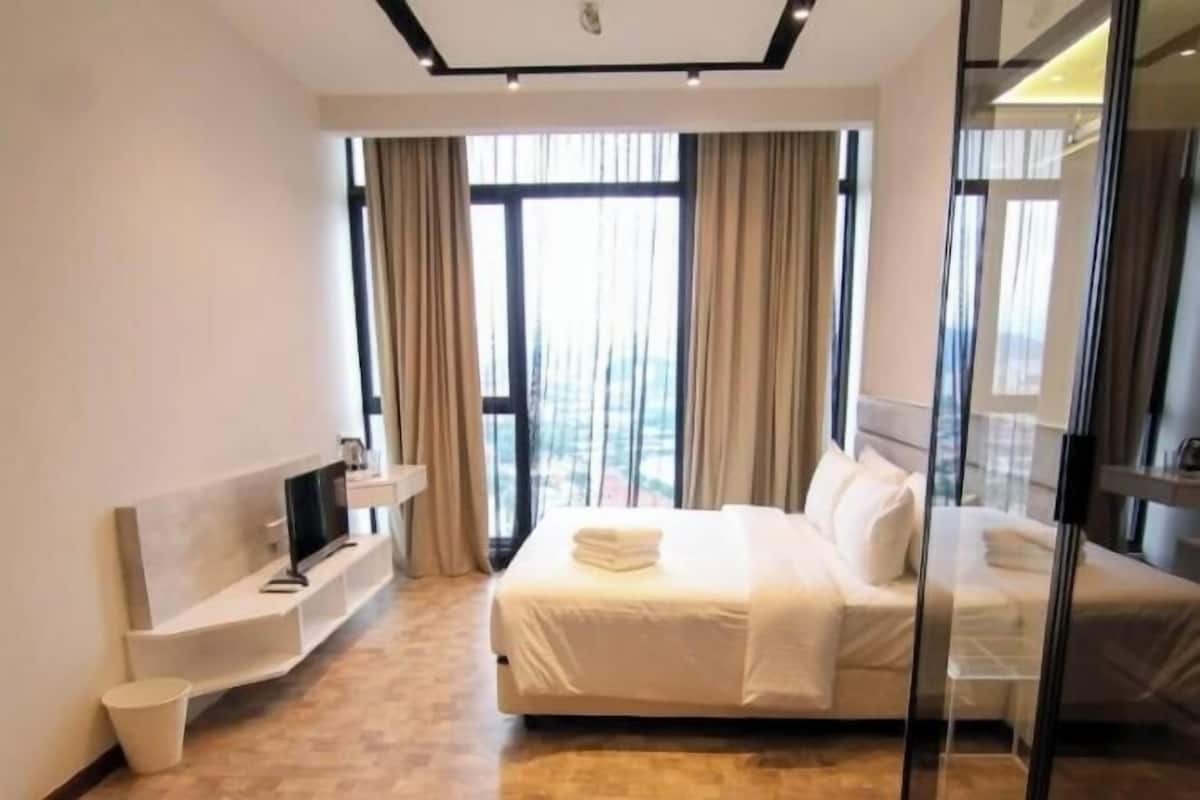 Desk, laptop workspace, blackout drapes, iron/ironing board