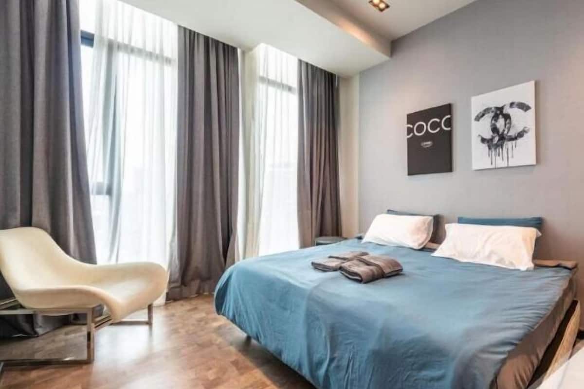 Desk, laptop workspace, blackout drapes, iron/ironing board