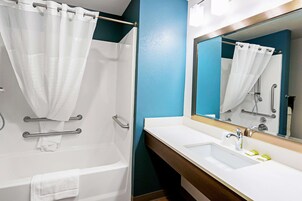 Combined shower/tub, hair dryer, towels, soap