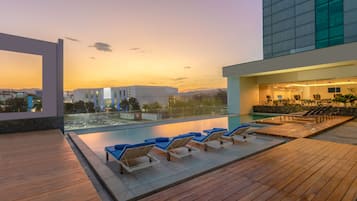 Outdoor pool, open 6 AM to 10 PM, pool cabanas (surcharge)