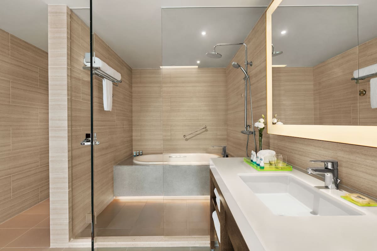 Designer toiletries, hair dryer, bathrobes, slippers