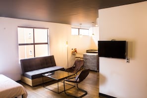 Loft, Multiple Beds | Living area | Flat-screen TV