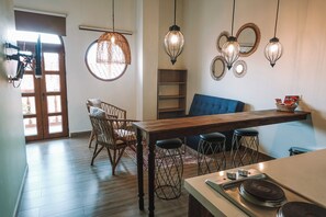 Duplex, Multiple Beds, Balcony | Living area | 32-inch flat-screen TV with cable channels, TV