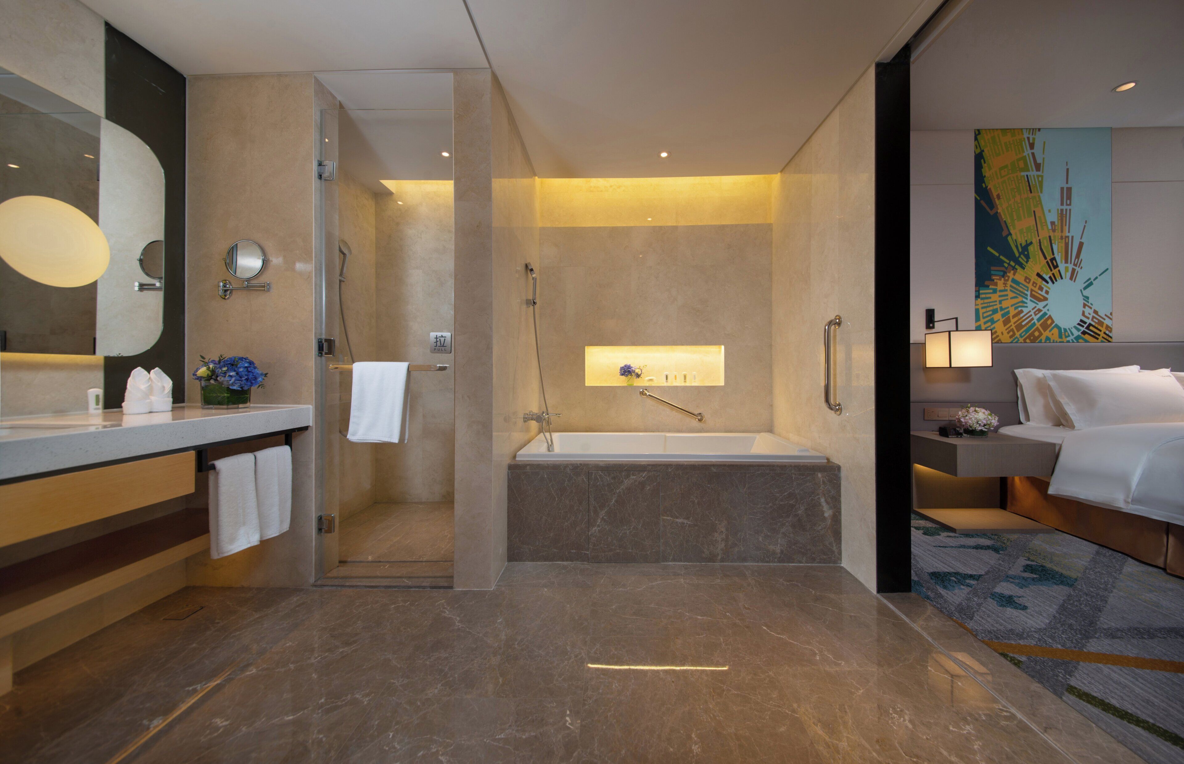 A modern bathroom with a glass shower enclosure, a bathtub, and a separate shower area.