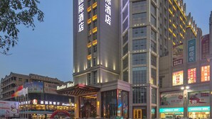 A hotel with multiple floors and a prominent entrance. - Guangzhou Manguo International Hotel (Guangzhou)