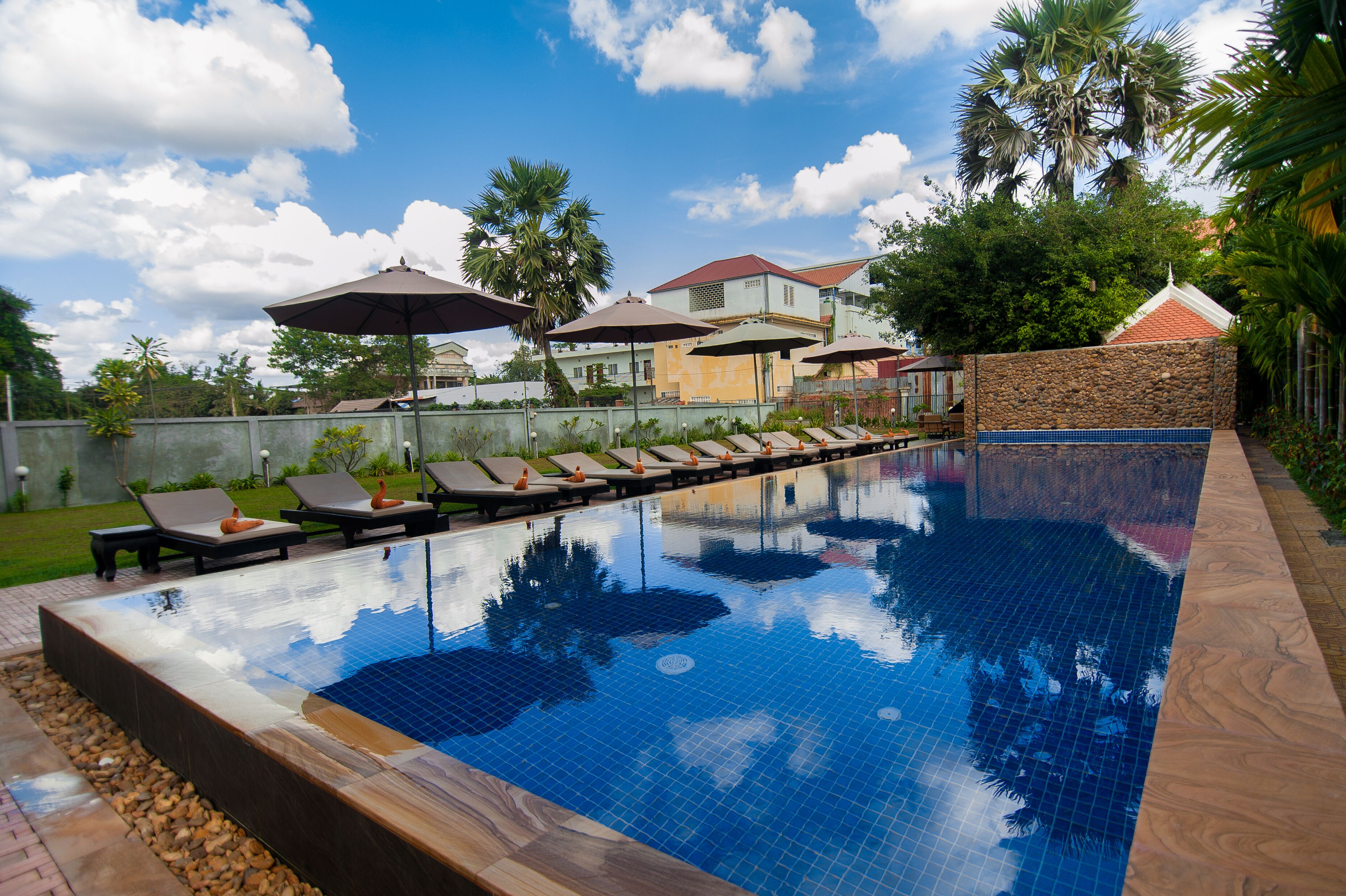 outdoor pool, open 8 am to 9:30 pm, pool umbrellas