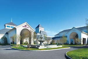A hotel with a central fountain, a grand ballroom, and a courtyard.