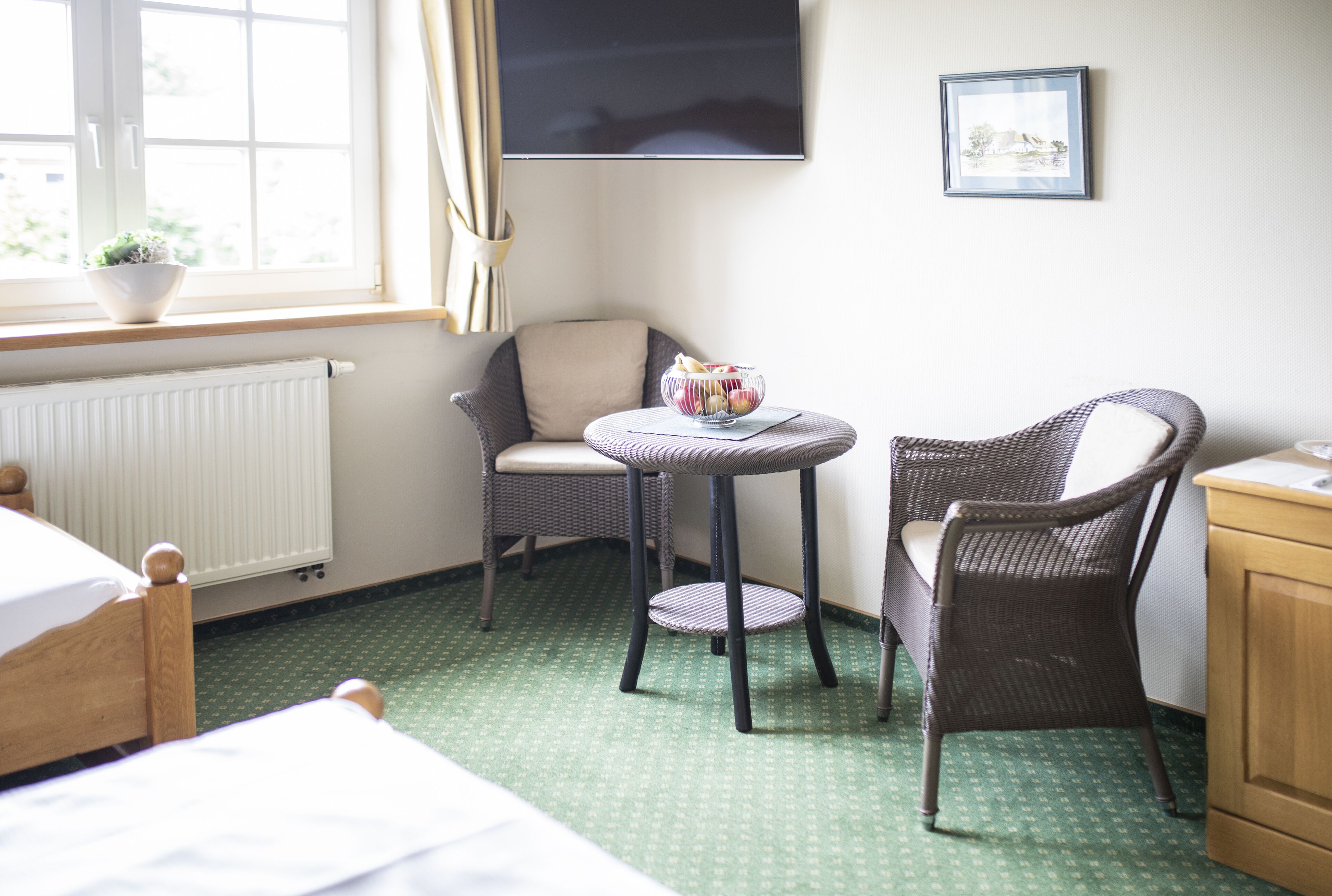 standard double room | living area | 32-inch flat-screen tv with cable channels, tv