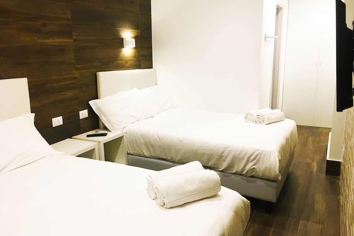 Quadruple Room | Premium bedding, minibar, in-room safe, blackout drapes