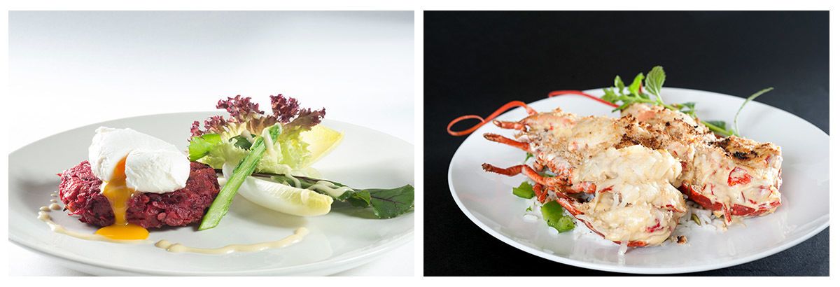 Two plates of food, one with a red meat dish and a poached egg, and the other with a seafood dish.