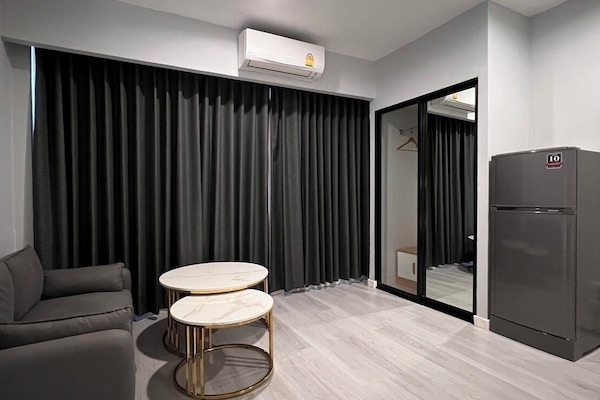 Luxury Room, Non Smoking | Living area | 55-inch Smart TV with cable channels, TV