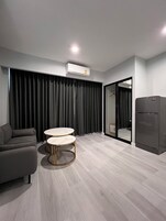 Luxury Room, Non Smoking | Living area | 55-inch Smart TV with cable channels, TV