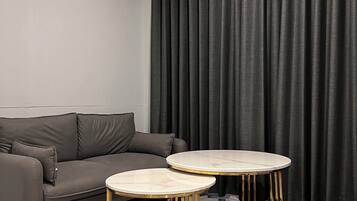 Luxury Room, Non Smoking | Living area | 55-inch Smart TV with cable channels, TV