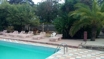 Outdoor pool, pool umbrellas, sun loungers