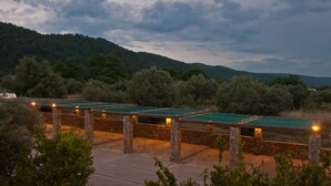 Outdoor ping pong tables with stone pillars, surrounded by trees and hills. - Sofia's House (Sithonia)