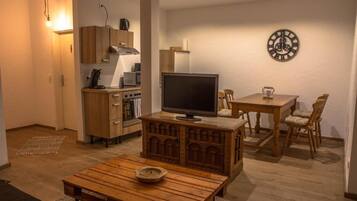 38-inch LCD TV with satellite channels, TV, DVD player