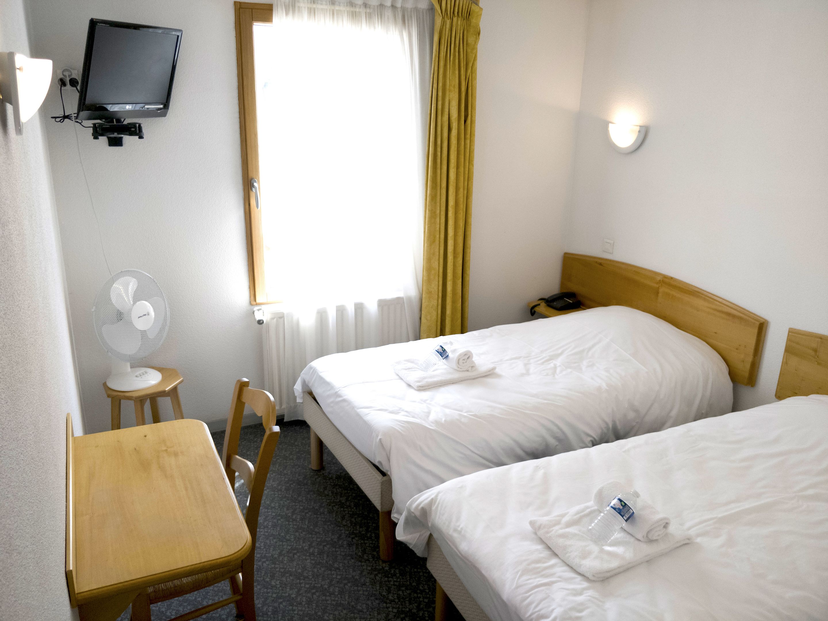 standard twin room | individually decorated, individually furnished, desk, blackout curtains