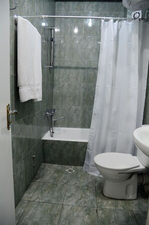 Shower, free toiletries, hair dryer, slippers