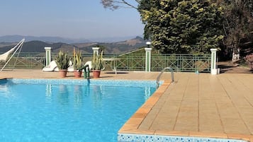 Outdoor pool, pool umbrellas, sun loungers