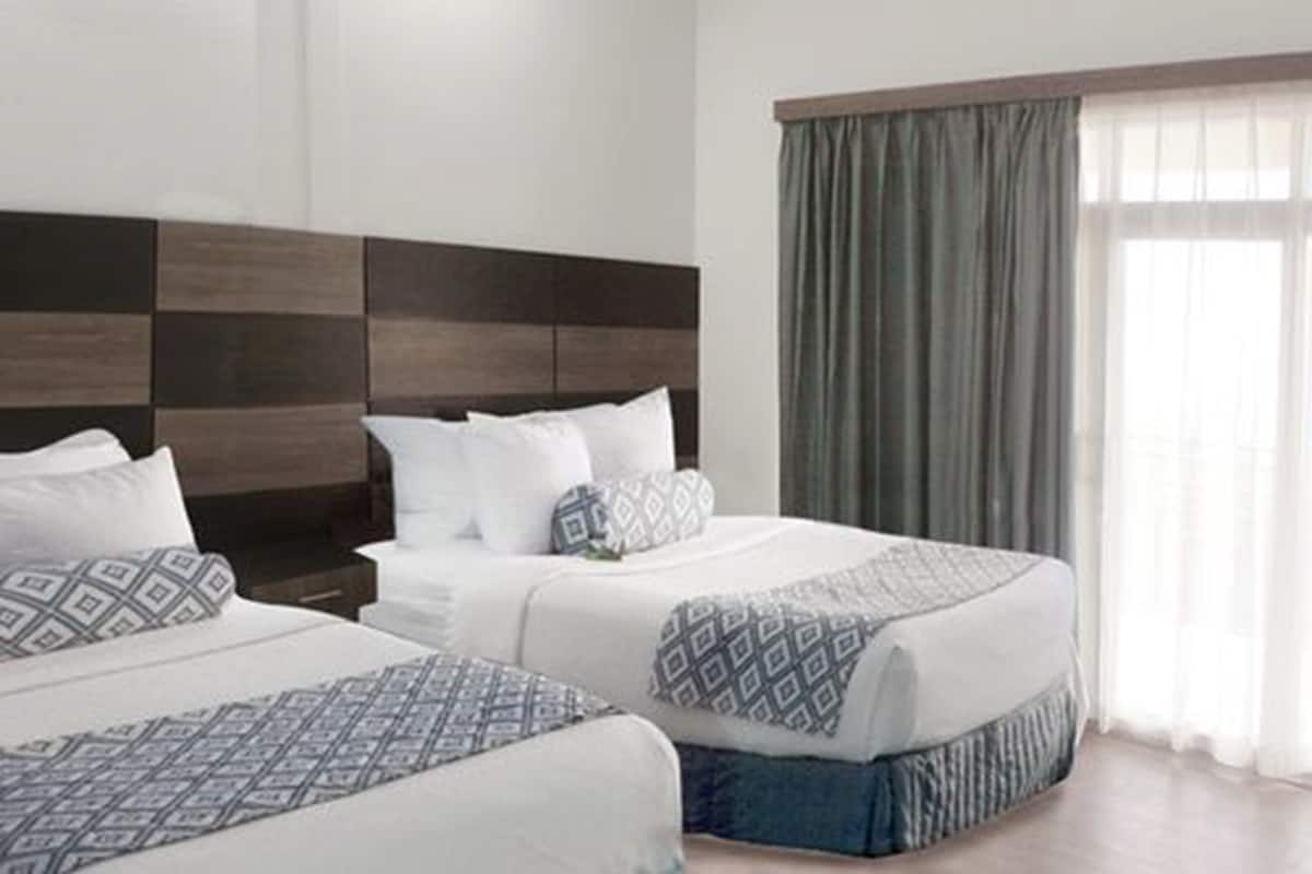 executive double room, 2 queen beds, non smoking | minibar, desk, blackout curtains, iron/ironing board