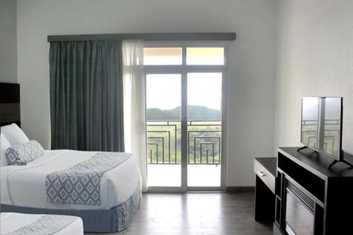 deluxe double room, 2 queen beds, non smoking | minibar, desk, blackout curtains, iron/ironing board