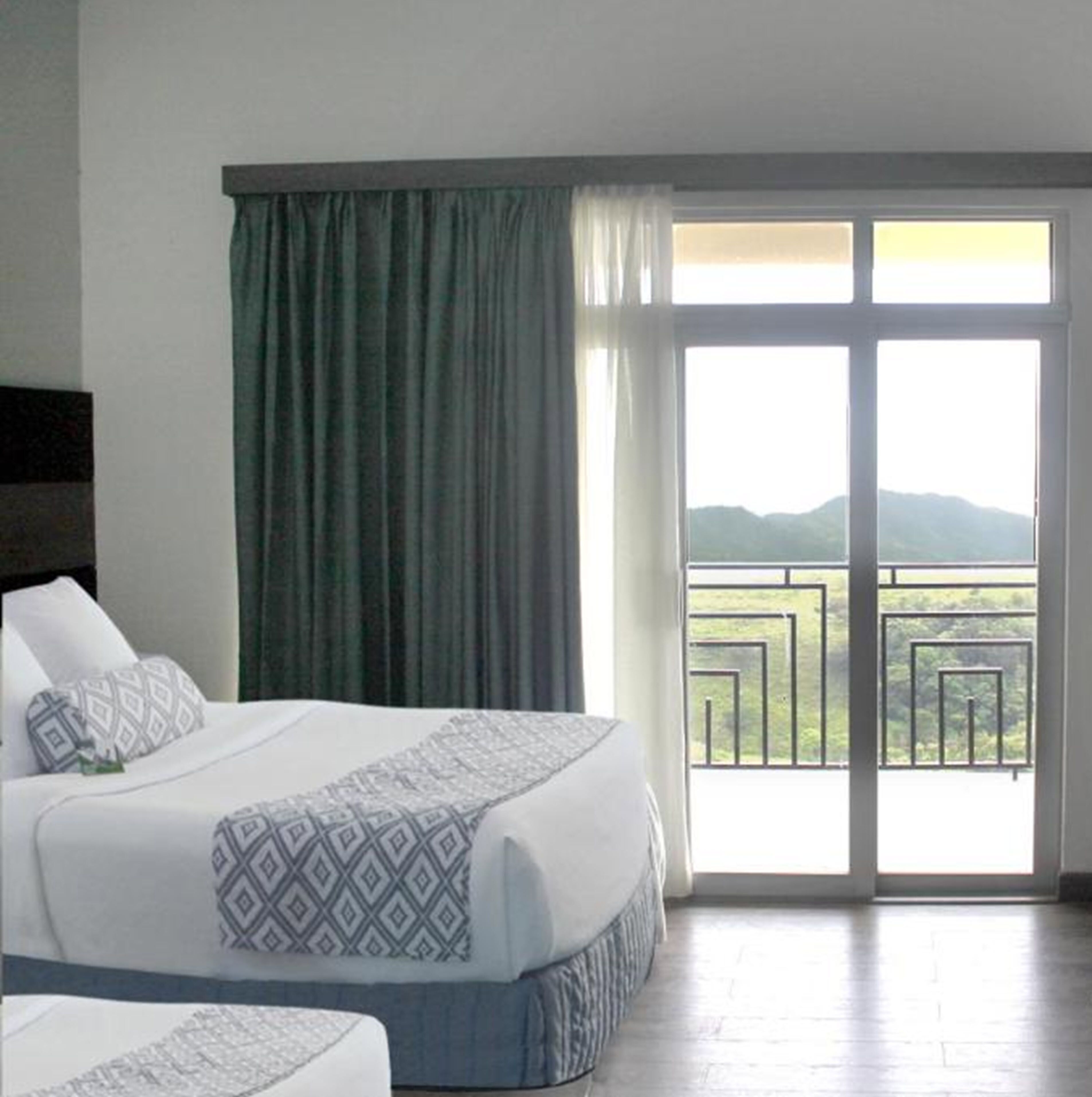 deluxe double room, 2 queen beds, non smoking | minibar, desk, blackout curtains, iron/ironing board