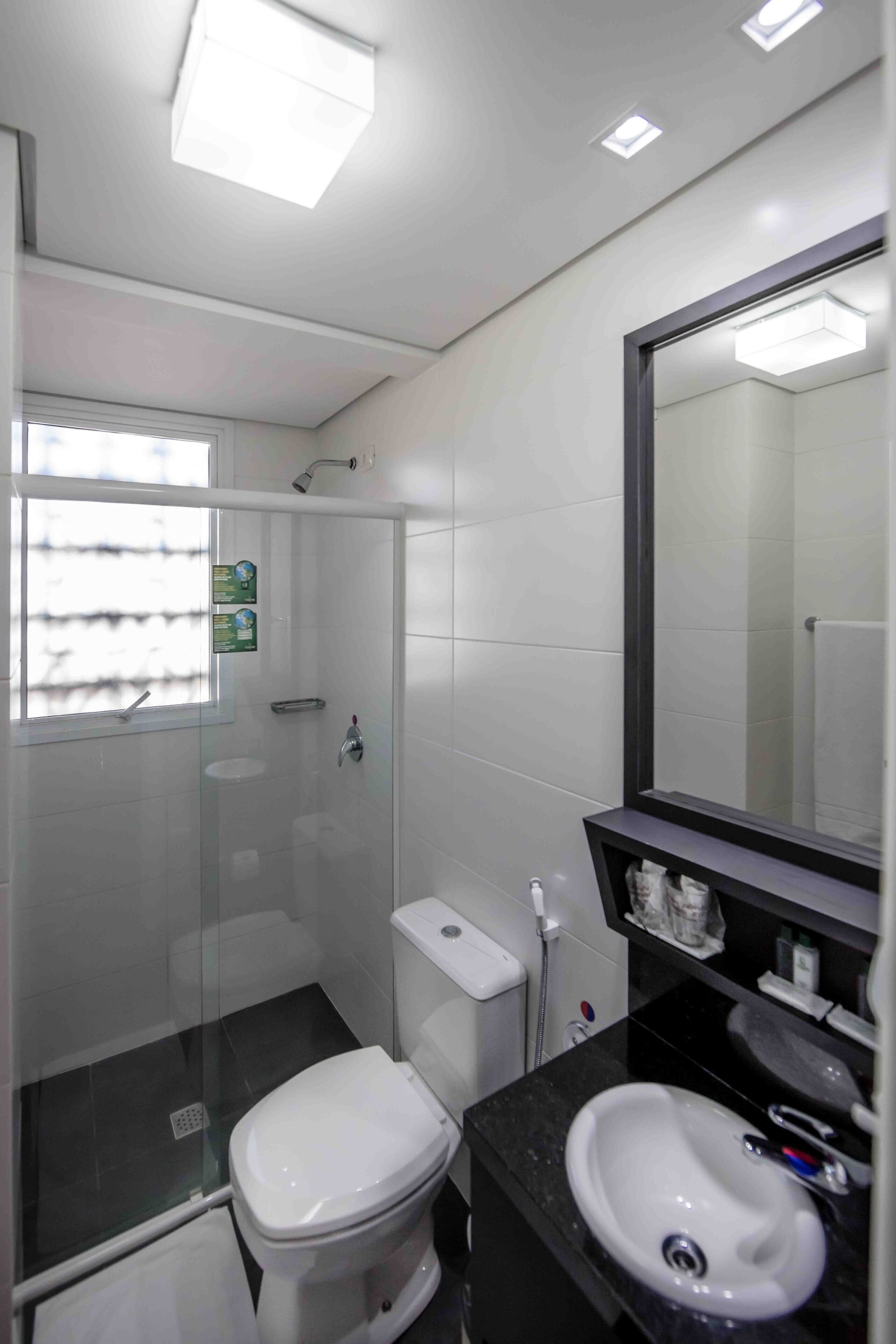 standard twin room | bathroom | shower, rainfall showerhead, free toiletries, hair dryer