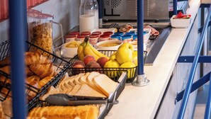 A buffet setup with various food items and condiments. - ibis budget Le Cannet des Maures (Le Cannet-des-Maures)