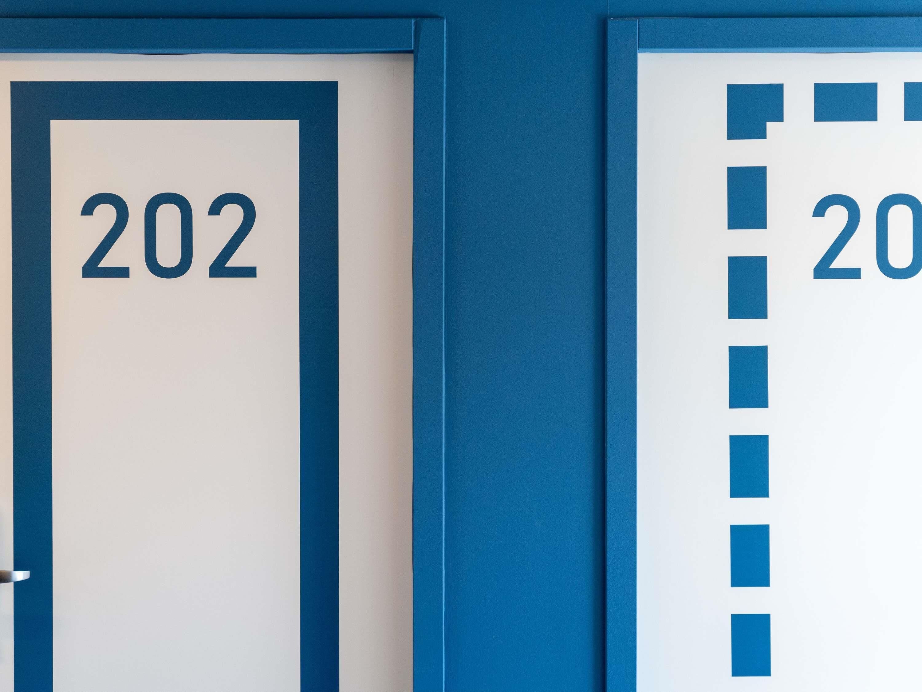 Two doors with numbers 202 and 20.