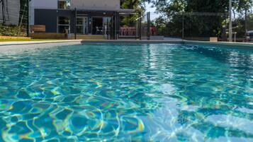 Seasonal outdoor pool, open 9:00 AM to 8:00 PM, pool loungers