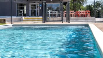 Seasonal outdoor pool, open 9:00 AM to 8:00 PM, pool loungers