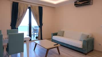 Apartment, 2 Bedrooms, Sea View | Desk, blackout drapes, soundproofing, iron/ironing board