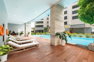 Outdoor pool, open 6:00 AM to 10:00 PM, sun loungers