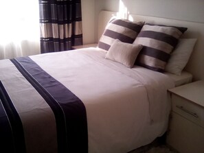 Premium bedding, desk, blackout curtains, soundproofing