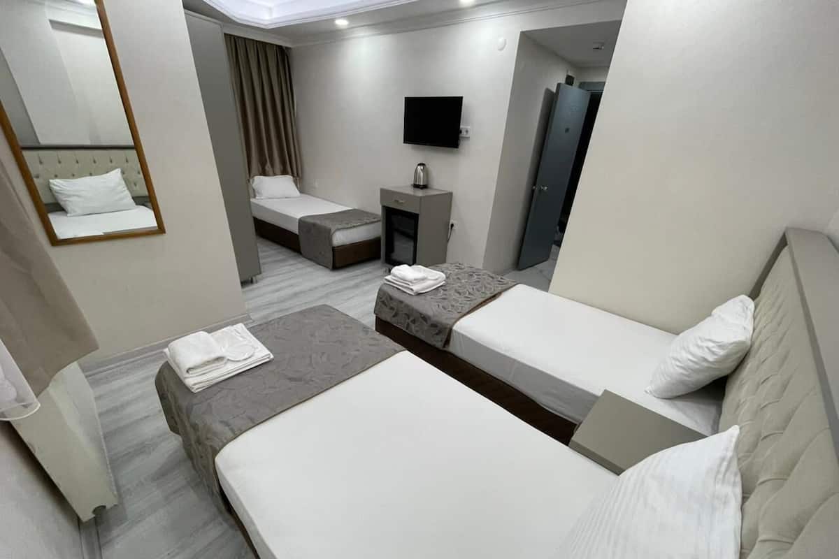 Quarto triplo standard | Frigobar, roupa de cama