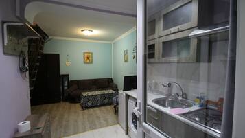 Deluxe Duplex, 1 Queen Bed with Sofa bed, Non Smoking | Living room