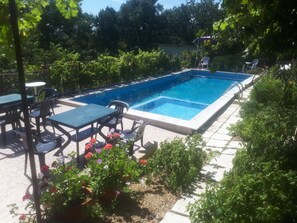 Seasonal outdoor pool, pool umbrellas, pool loungers