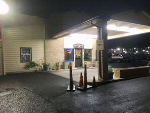 A building with a registration sign, a parking lot, and a 'KEEP' sign.