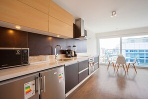 Deluxe Apartment, 2 Bedrooms, Non Smoking, Private Bathroom | Private kitchen | Full-size fridge, microwave, oven, stovetop