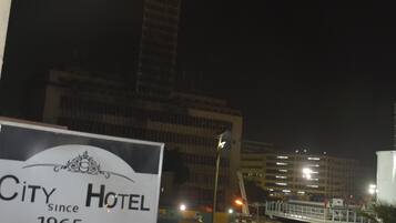 A hotel sign with the name "City Hotel" and the text "since 1965".