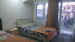 Standard Triple Room, Balcony, Sea View | In-room safe, free WiFi