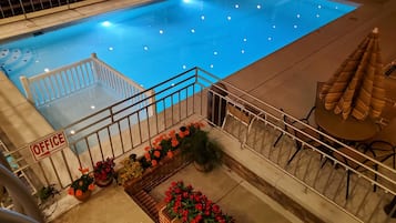 Seasonal outdoor pool, open 10:00 AM to 7:00 PM, pool umbrellas