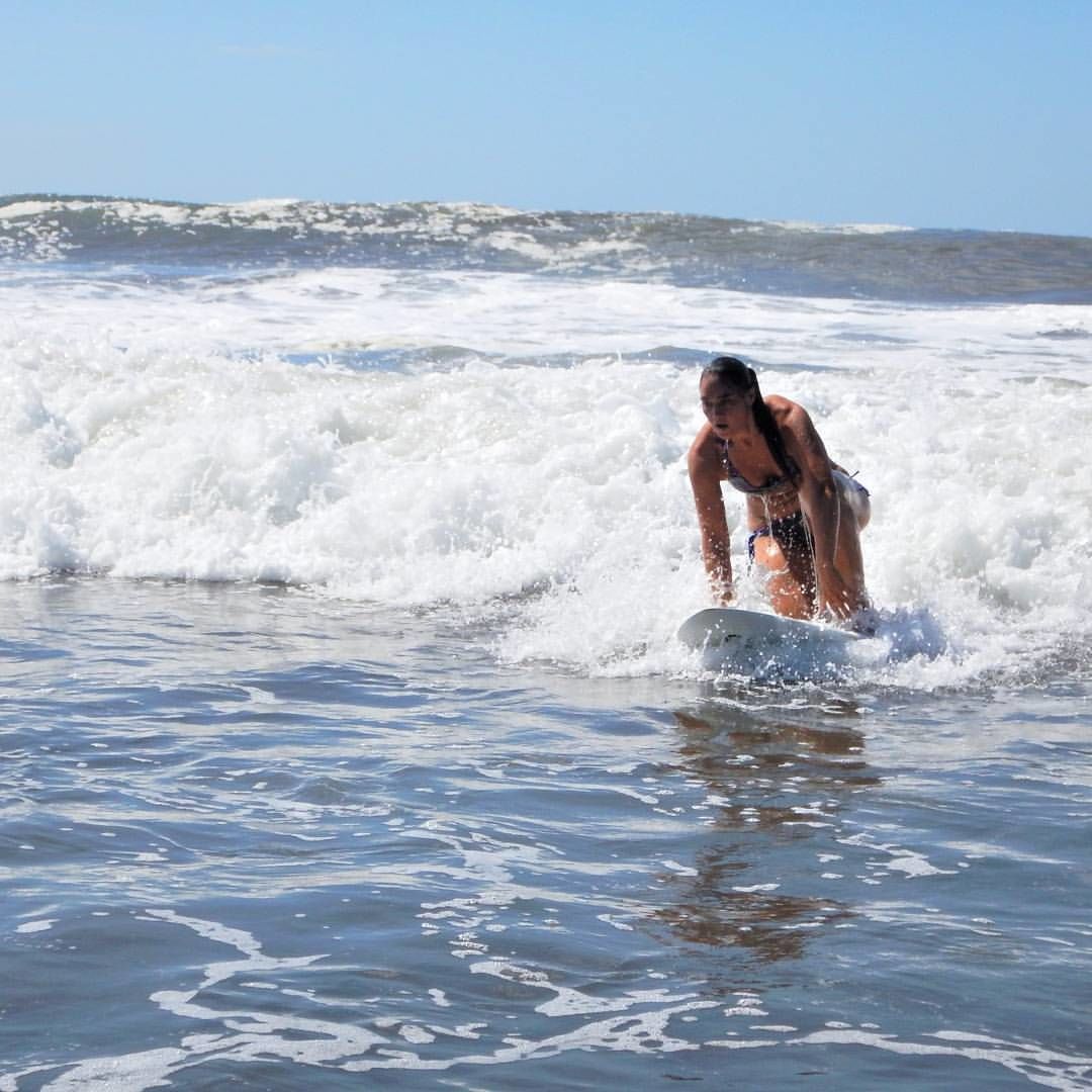 A person surfing in the ocean.