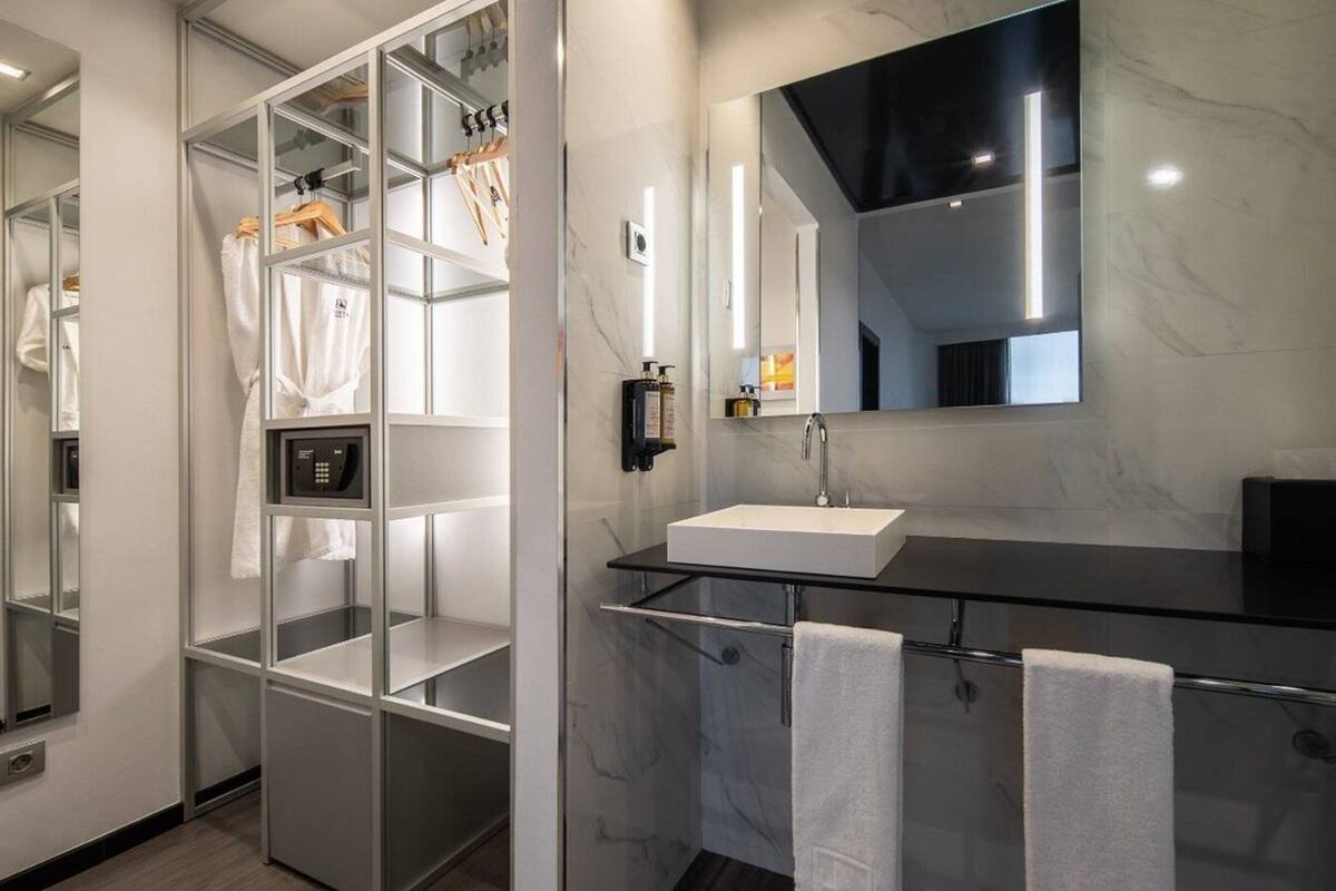 family room | 1 bedroom, minibar, in-room safe, desk